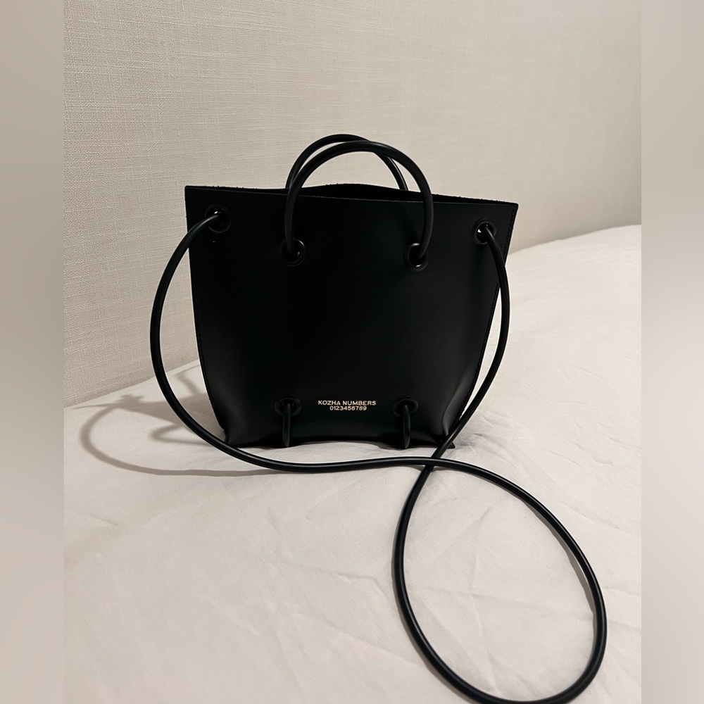 KOZHA NUMBERS BAG.